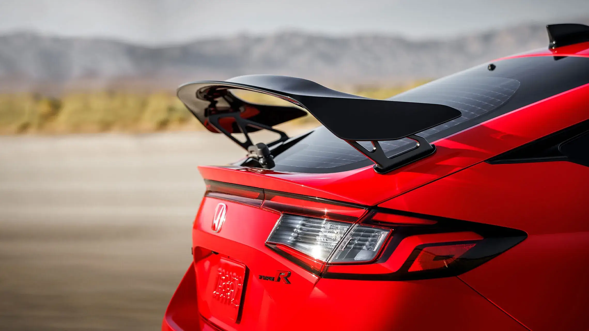Honda Civic Type R rear wing and aerodynamic bodywork generating downforce, available at Plaza Honda in Brooklyn, NY