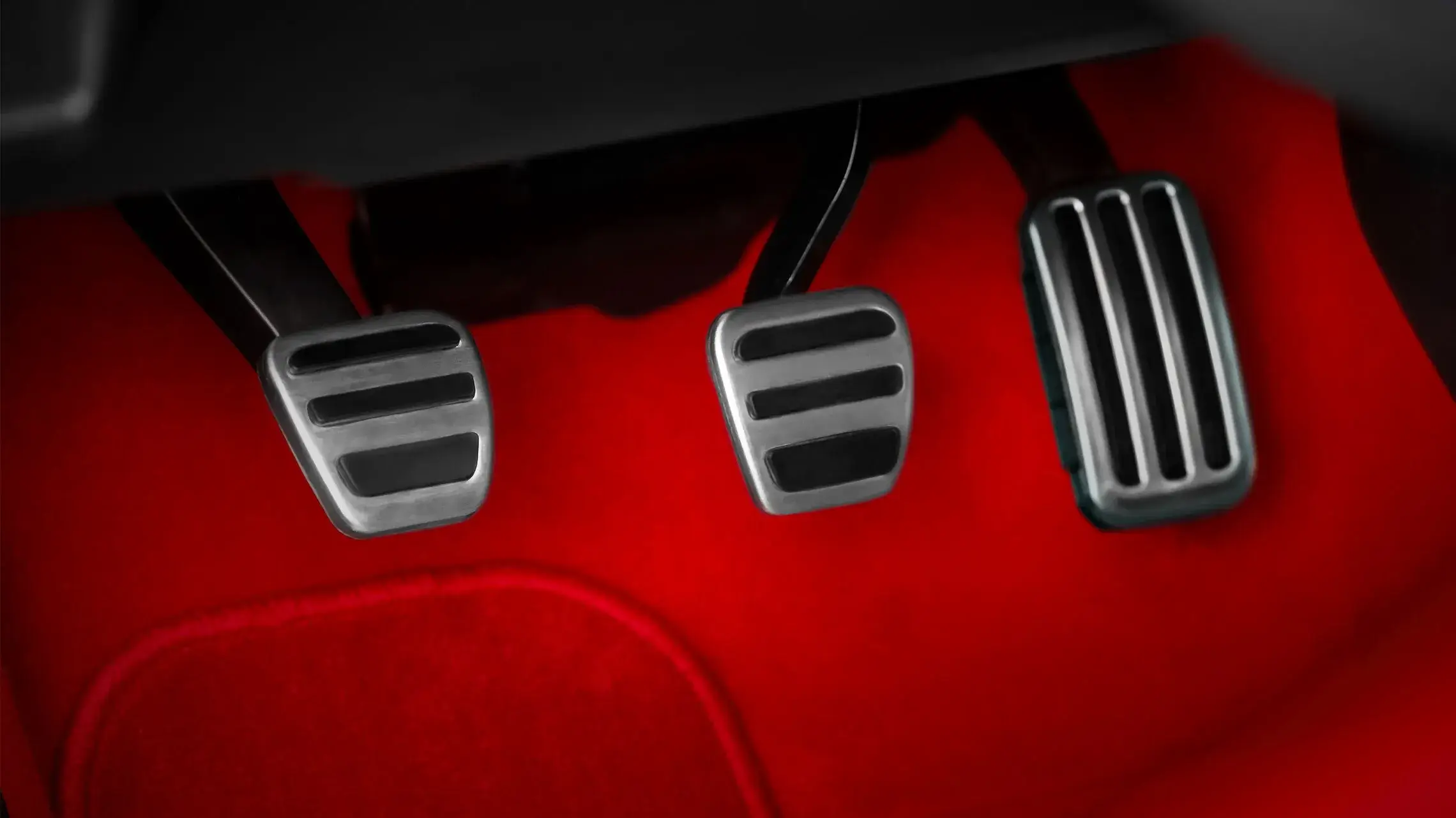 Aluminum sport pedals and metal footrest in the Honda Civic Type R footwell