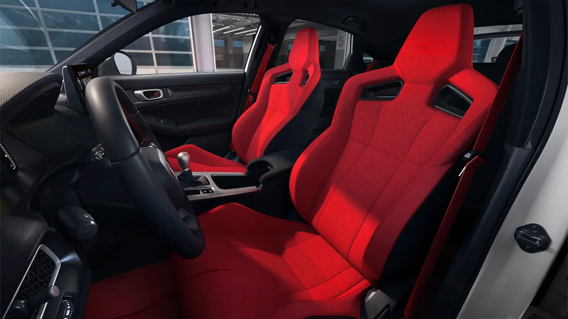 Red suede-effect Honda Civic Type R sport seats with deep bolsters and Type R embroidery