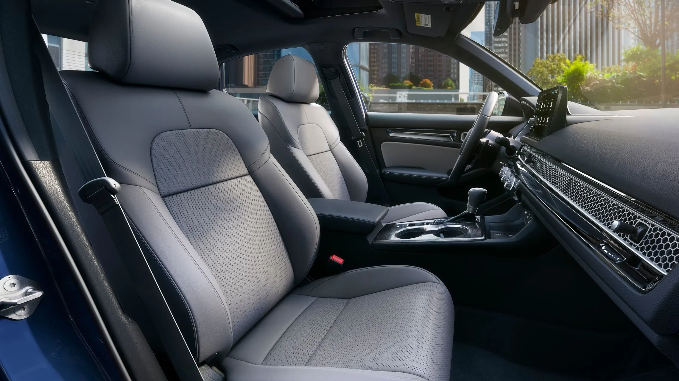 2027 Honda Civic Sedan interior showing front seats, dashboard and center console