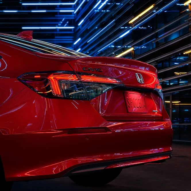 Red Honda Civic with LED taillights against a neon-lit wall, rear view