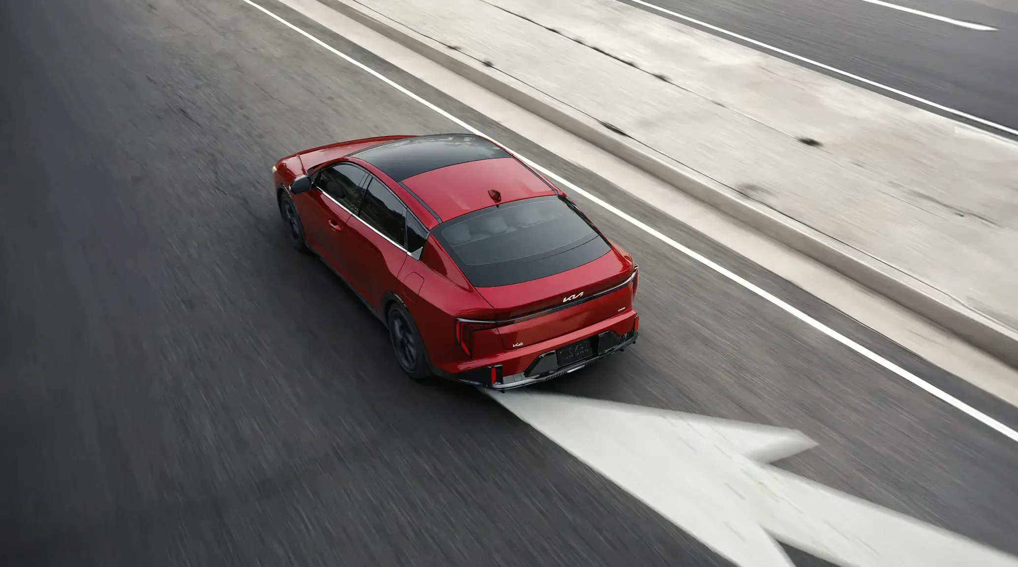 Aerial view of the 2027 Kia K4 highlighting its sculpted roofline and proportions
