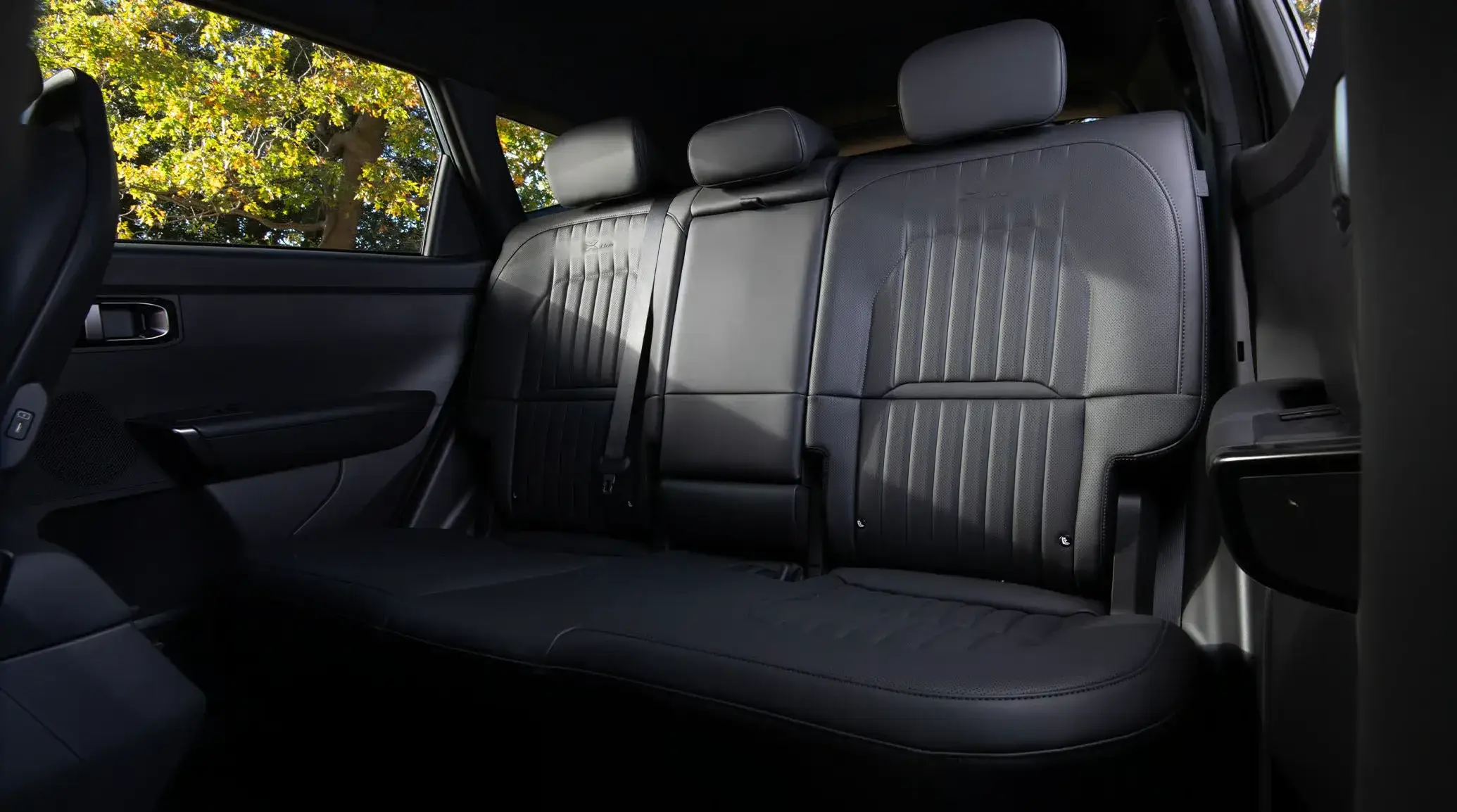 Rear seats of the 2027 Kia Seltos showing legroom and 60/40 split folding bench