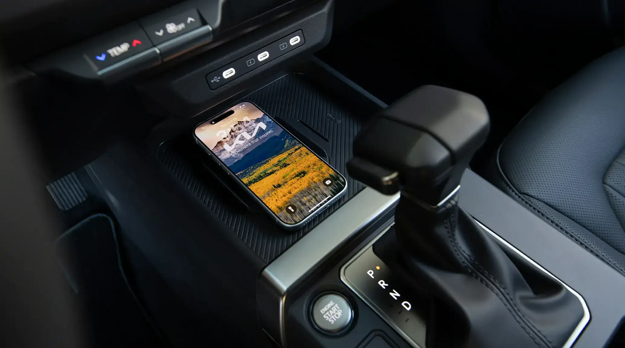 2027 Kia Seltos center console with wireless phone charging pad and transmission controls