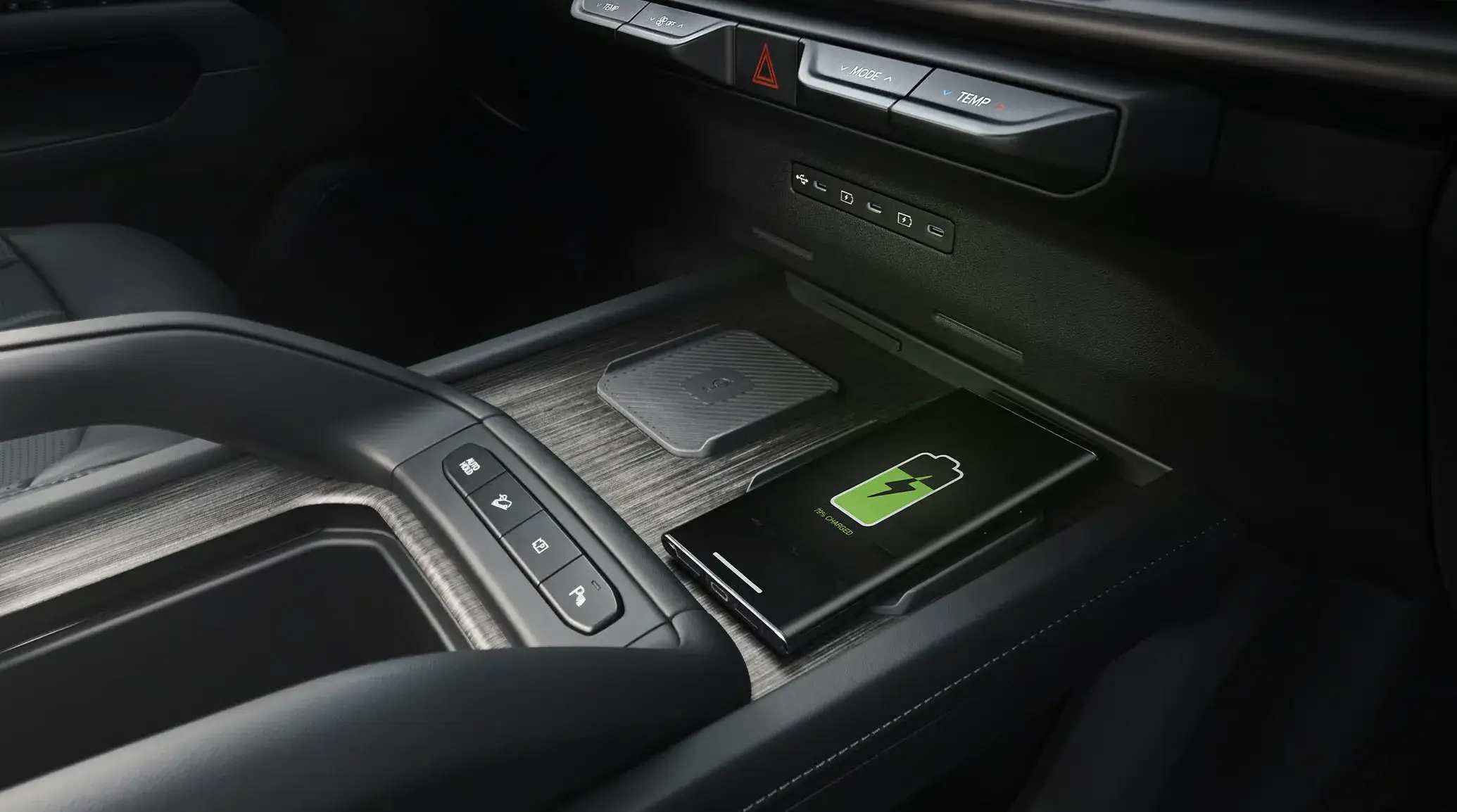 Dual wireless smartphone charging pads in the front console of the 2027 Kia Telluride Hybrid