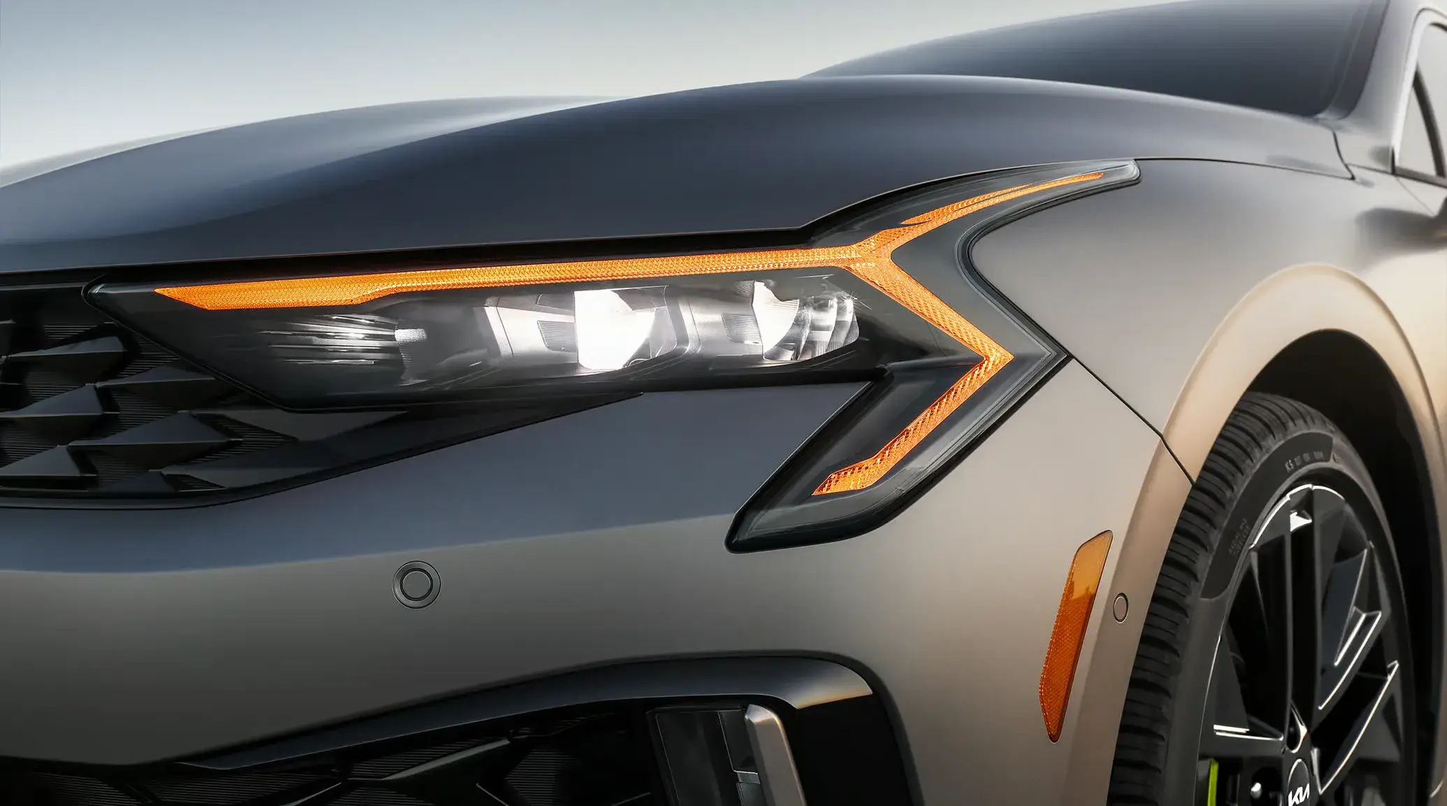 Close view of the 2027 Kia K5 front lighting signature and grille treatment