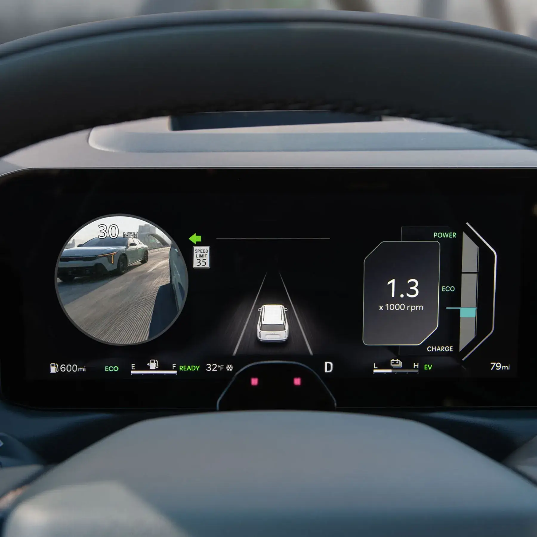 Blind-Spot View Monitor in the 2027 Kia Telluride Hybrid displaying a live camera feed of the left lane during a turn