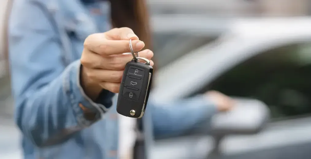 Customer holding a vehicle key.