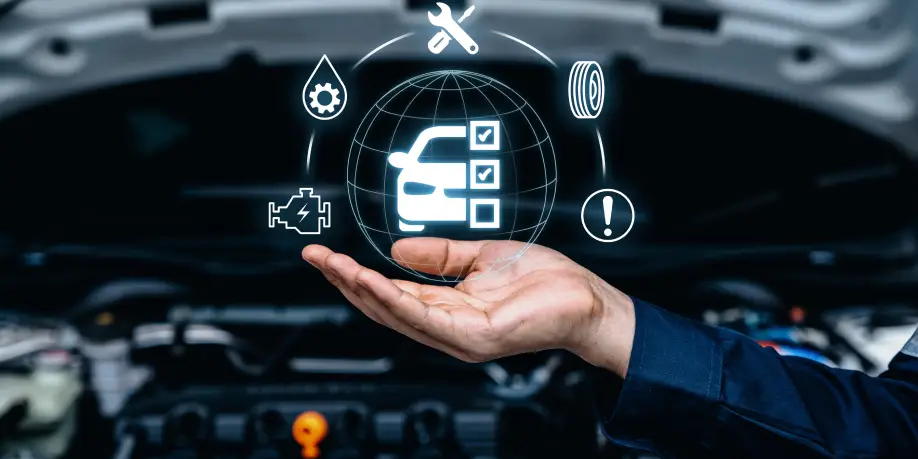 Technician’s hand under a digital vehicle maintenance checklist above an open engine bay