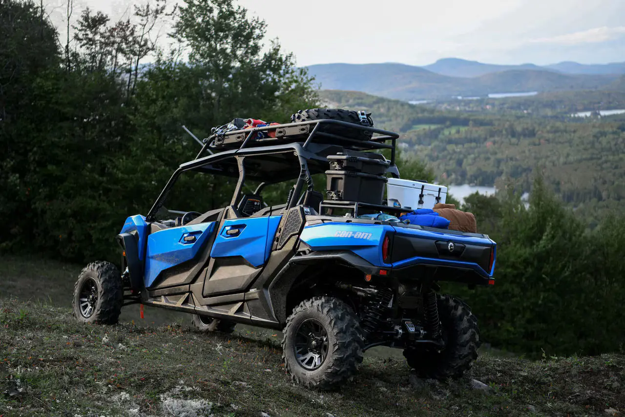 blue utv parked in the mountains