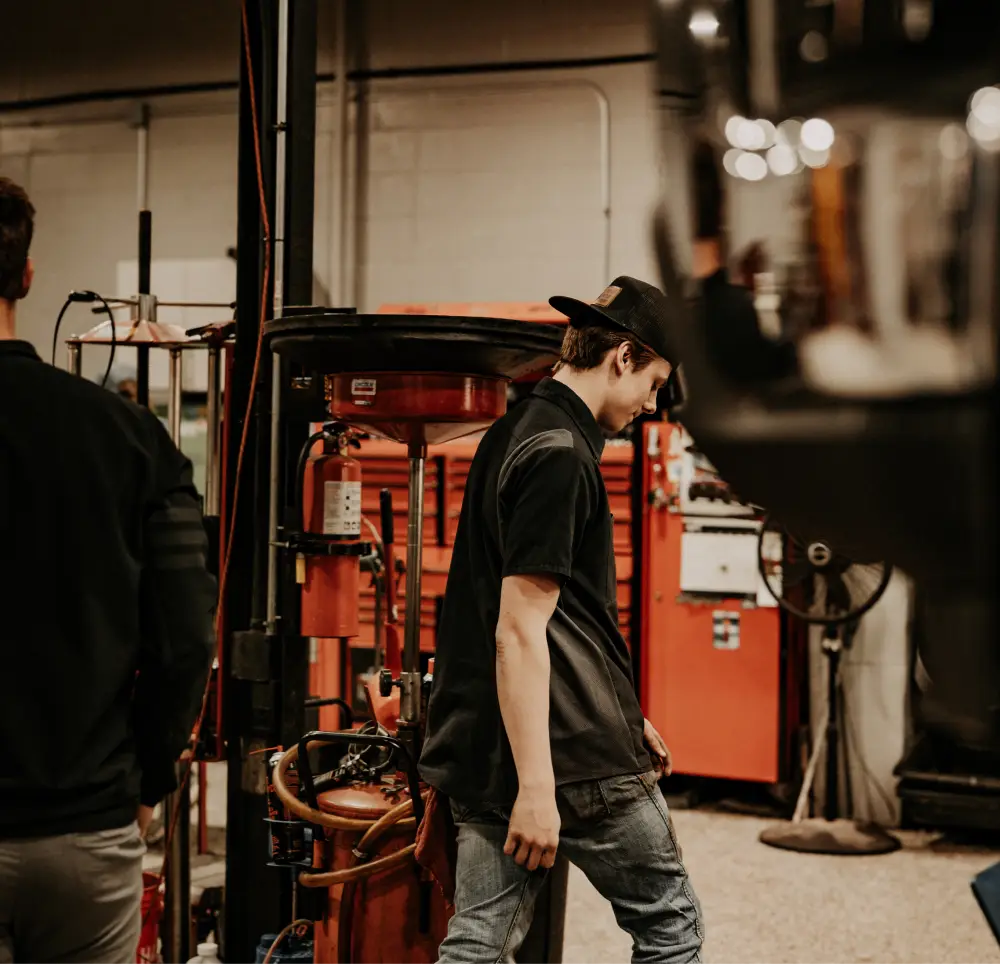 Tailgate Garage service technician inside the repair shop