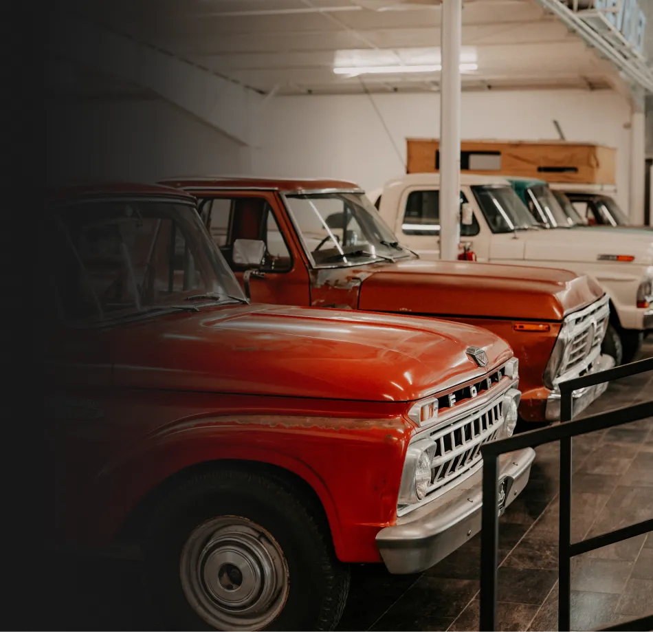 Classic red truck inside the Tailgate Motor Co. showroom