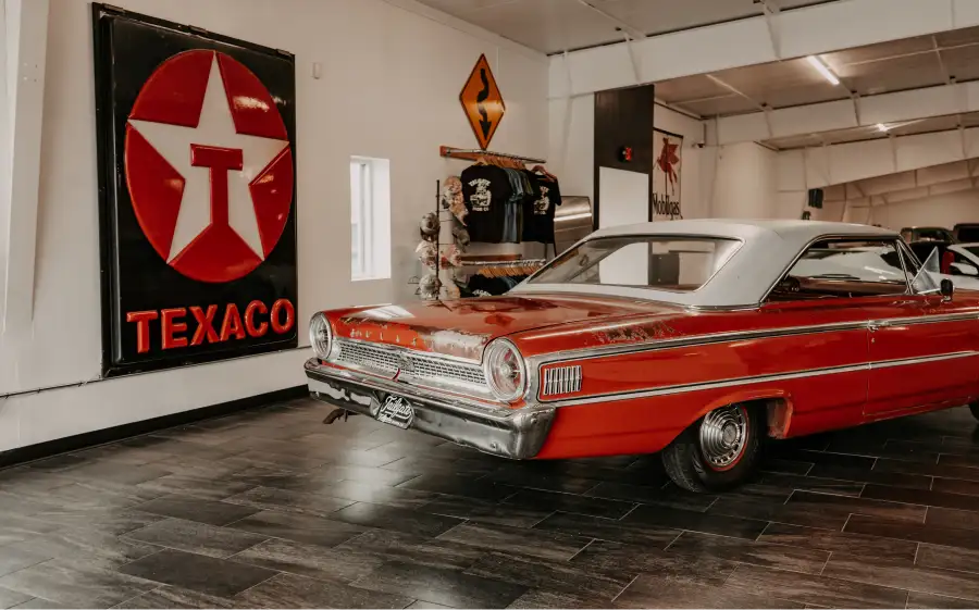 Classic red Ford inside the Tailgate Motor Co. showroom
