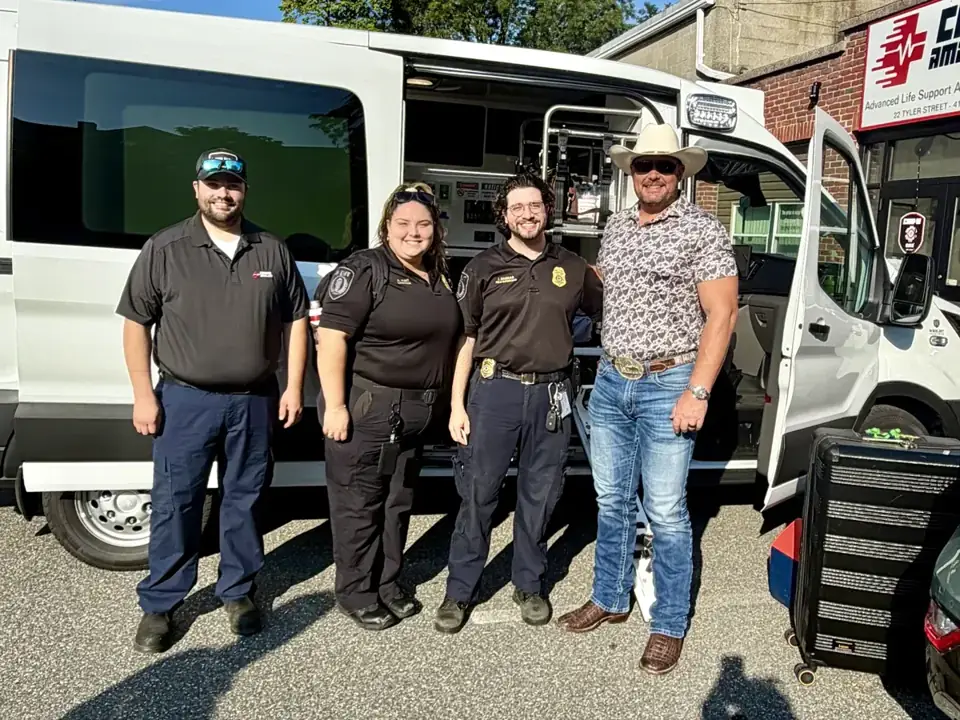 Trinity Apparatus team standing in front of a white transport van