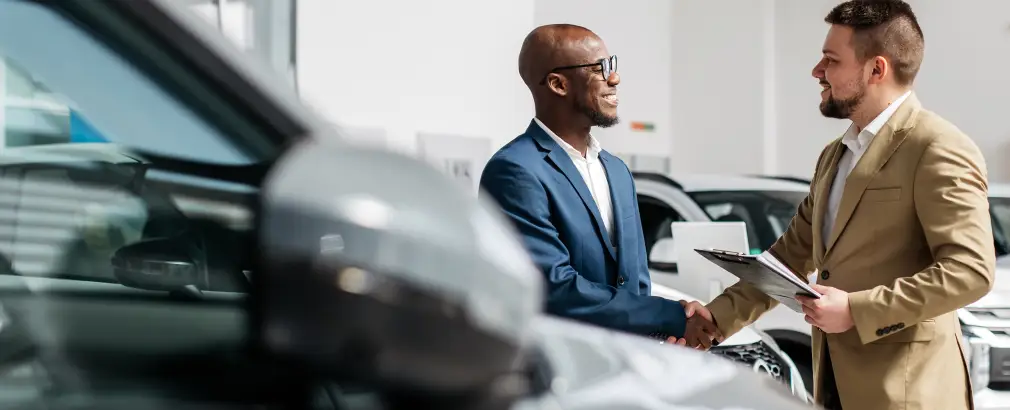 Customer discussing a used car purchase at Ultimate Autos in Mesa, AZ