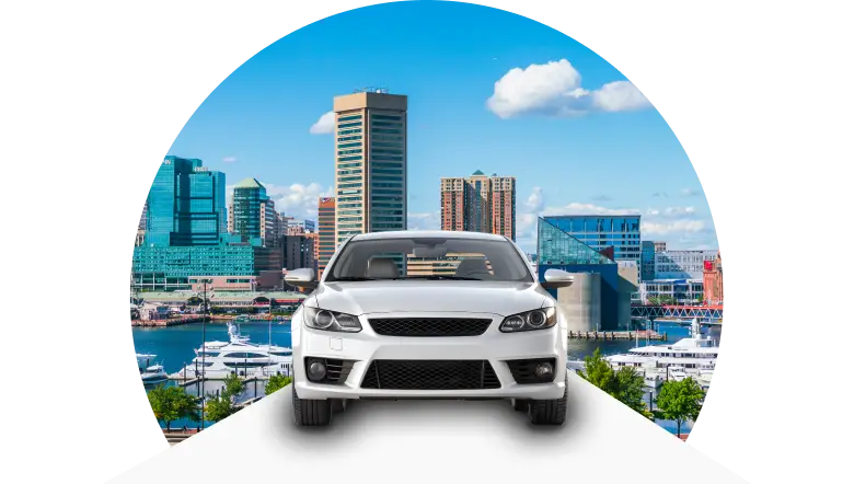 Front view of car with Baltimore city skyline background.