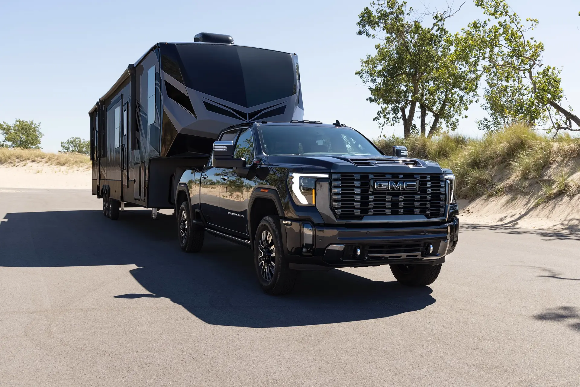 Truck Towing a Fifth Wheel Camper on Road
