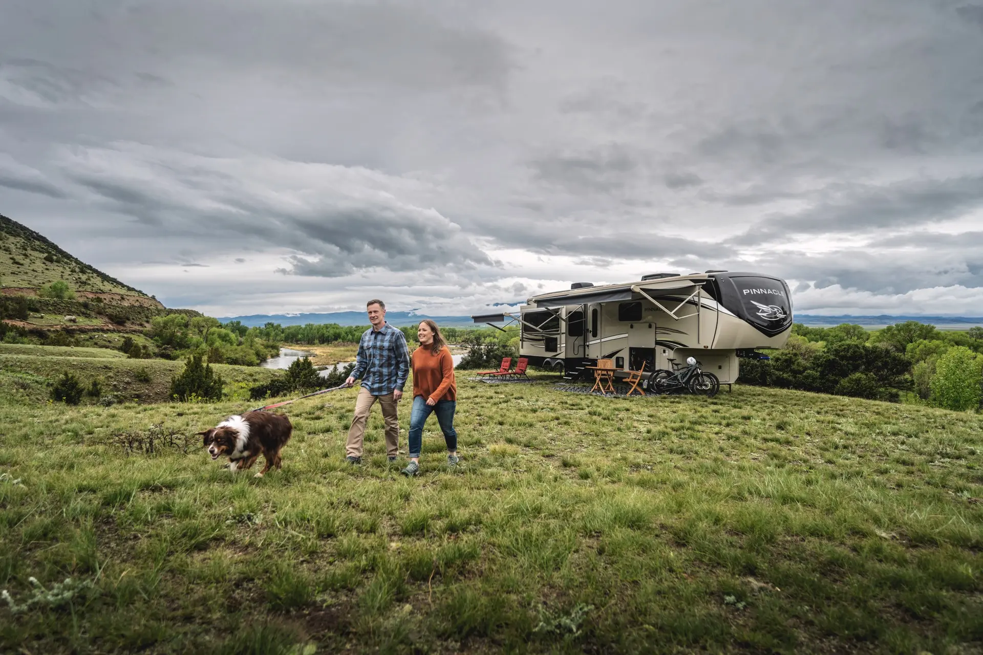 Couple Walking Dog at Campsite