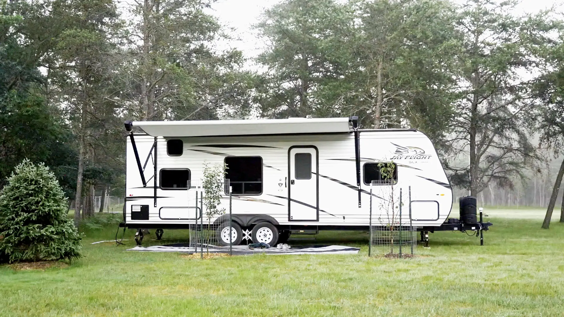 Jay Flight Camper Set Up in Grassy Area