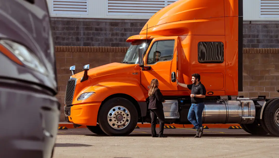 Customer speaking with a Team Wieland Truck & Trailer representative about financing