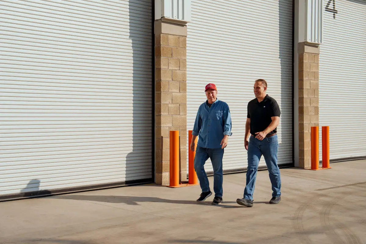 Team Wieland Truck & Trailer staff in the service bay with a customer discussing lease options