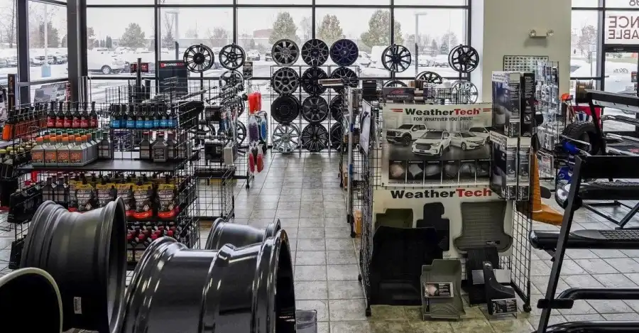 Custom wheels and truck accessories displayed in the Xtreme Truck & Auto Center showroom