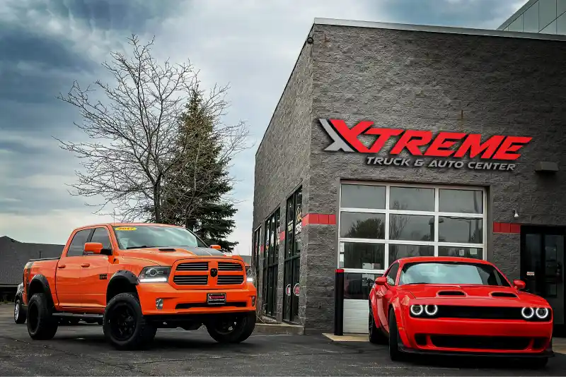 Xtreme Truck & Auto Center exterior sign above accessory brand window decals