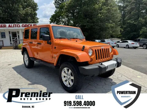 Orange 2012 Jeep Wrangler Unlimited Sahara for sale in Durham, NC