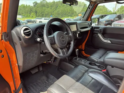 Photos of 2012 Jeep Wrangler Unlimited Sahara for sale in Durham, NC at Premier Auto Group