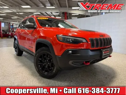 Orange 2021 Jeep Cherokee Trailhawk for sale in Coopersville, MI