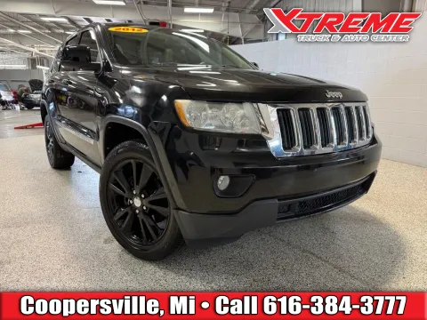 Black 2012 Jeep Grand Cherokee Laredo for sale in Coopersville, MI