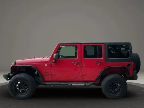 Photos of 2013 Jeep Wrangler Unlimited Sport S SUV 4D for sale in Altavista, VA at DNX Motors Altavista