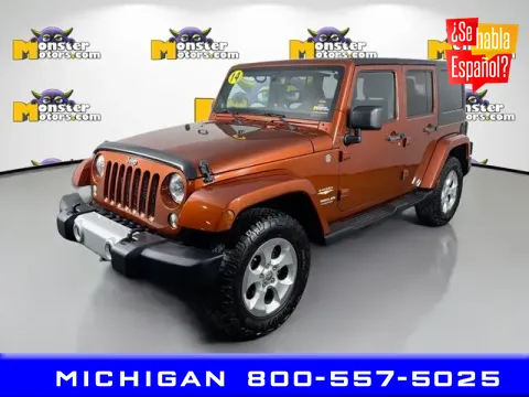 Red 2014 Jeep Wrangler Unlimited Sahara for sale in Michigan Center, MI