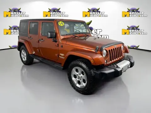 Another view of 2014 Jeep Wrangler Unlimited Sahara for sale in Michigan Center, MI at Monster Motors - Jackson, MI