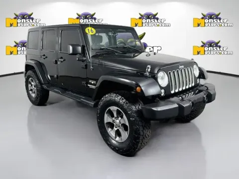 Another view of 2016 Jeep Wrangler Unlimited Sahara for sale in Michigan Center, MI at Monster Motors - Jackson, MI