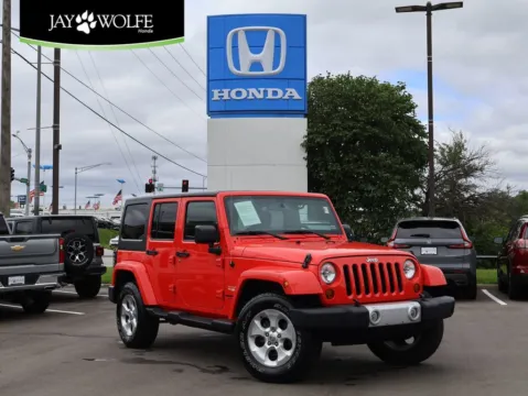Red 2013 Jeep Wrangler Unlimited Sahara for sale in Kansas City, MO