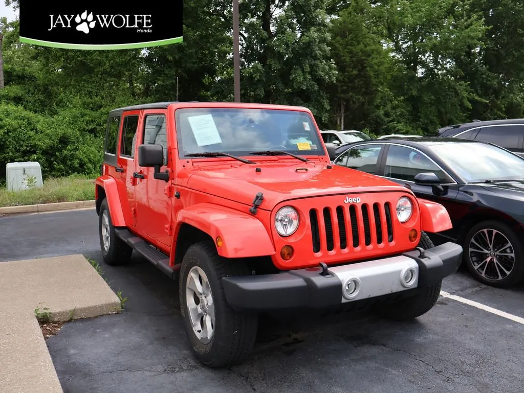 Red 2013 Jeep Wrangler Unlimited Sahara for sale in Kansas City, MO