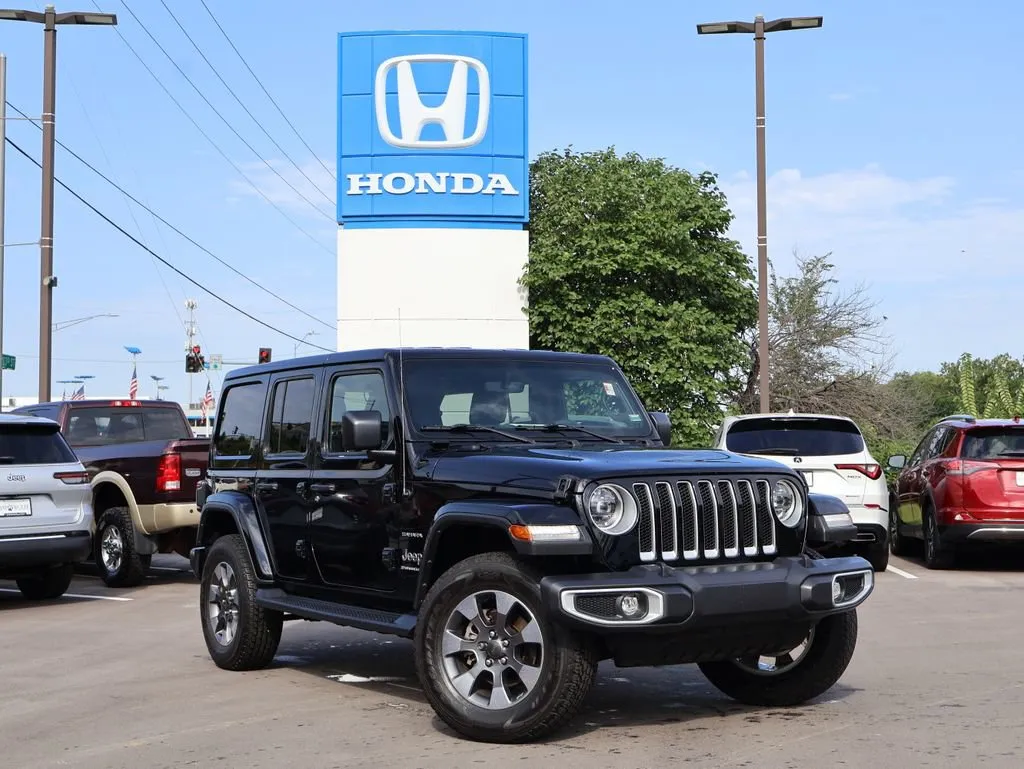 Black 2023 Jeep Wrangler Sahara for sale in Kansas City, MO