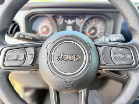 Photos of 2026 Jeep Wrangler Sport for sale in Gulfport, MS at Champion Chrysler Dodge Jeep Ram