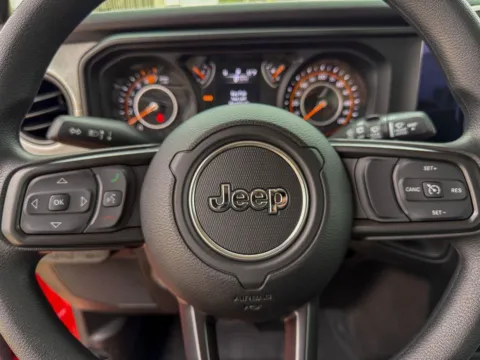 Photos of 2026 Jeep Wrangler Sport for sale in Gulfport, MS at Champion Chrysler Dodge Jeep Ram