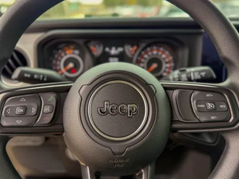 Photos of 2026 Jeep Wrangler Sport for sale in Gulfport, MS at Champion Chrysler Dodge Jeep Ram