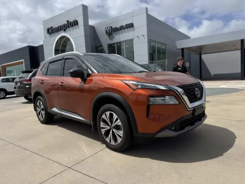 Orange 2022 Nissan Rogue SL for sale in Gulfport, MS