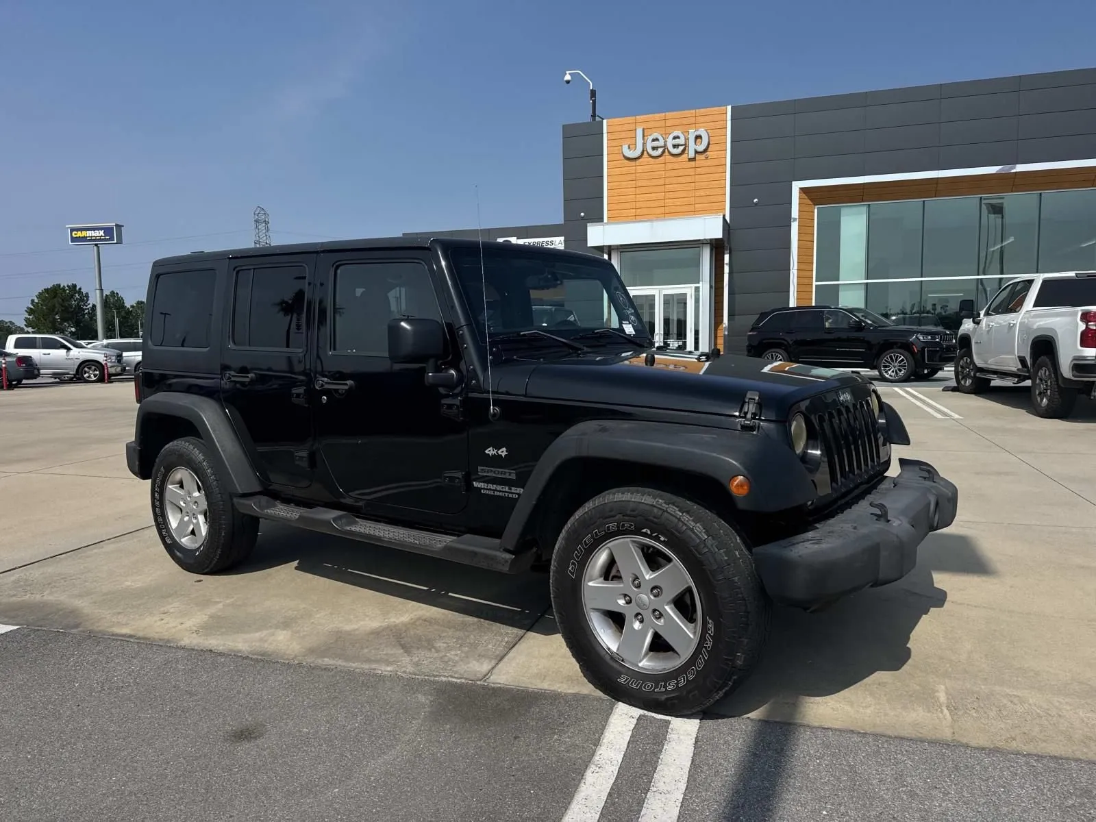 Used 2015 Jeep Wrangler Unlimited Sport with VIN 1C4BJWDG5FL507841 for sale in Gulfport, MS
