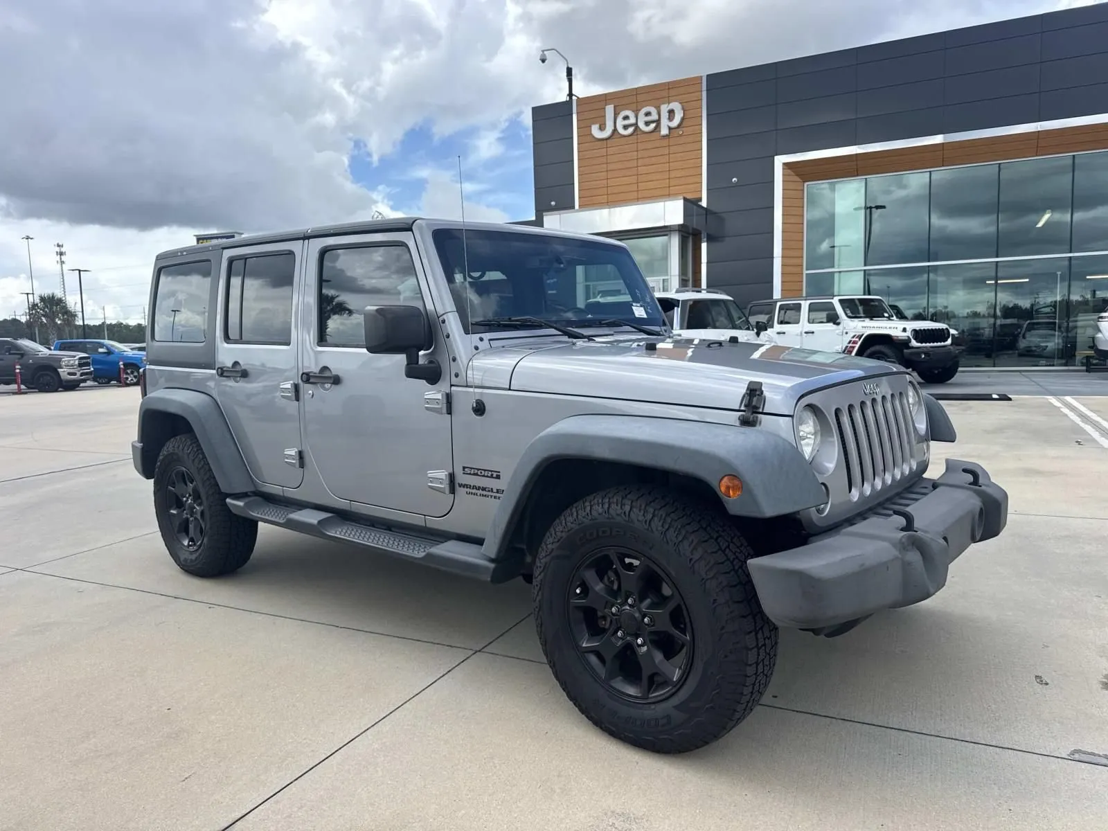 Silver 2015 Jeep Wrangler Unlimited Sport for sale in Gulfport, MS