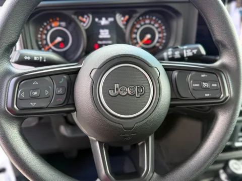 Photos of 2025 Jeep Wrangler Sport for sale in Gulfport, MS at Champion Chrysler Dodge Jeep Ram