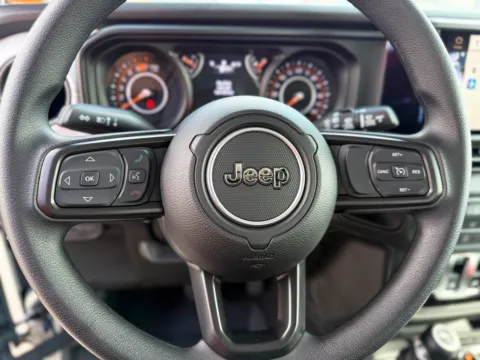 Photos of 2025 Jeep Wrangler Sport for sale in Gulfport, MS at Champion Chrysler Dodge Jeep Ram
