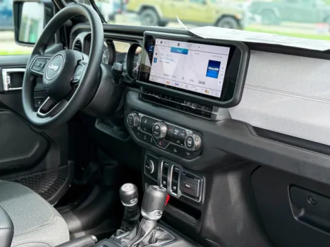 Photos of 2025 Jeep Wrangler Sport for sale in Gulfport, MS at Champion Chrysler Dodge Jeep Ram