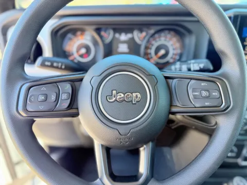 Photos of 2025 Jeep Wrangler Sport for sale in Gulfport, MS at Champion Chrysler Dodge Jeep Ram