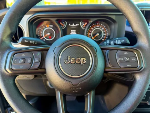 Photos of 2026 Jeep Wrangler Sport for sale in Gulfport, MS at Champion Chrysler Dodge Jeep Ram