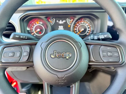 Photos of 2026 Jeep Wrangler Sport for sale in Gulfport, MS at Champion Chrysler Dodge Jeep Ram